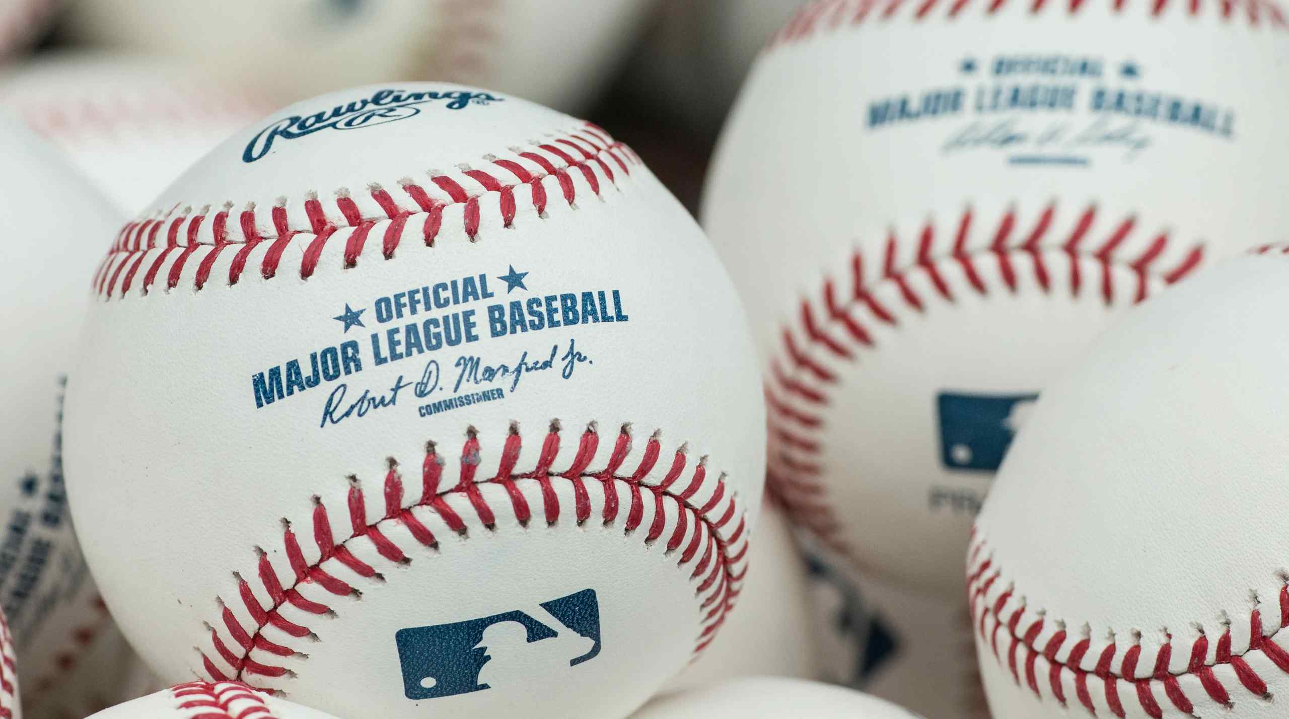 A collection of MLB baseballs.